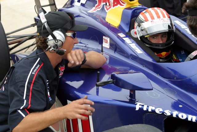 Red Bull Cheever racing driver Alex Barron, right, confers with crew member -- Photo by: Chris Jones