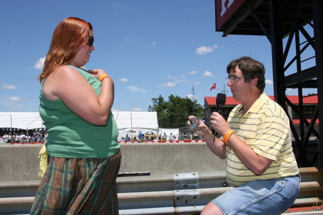 IndyCar fan proposes to his girl friend on pit lane before the Honda 200 at Mid-Ohio. -- Photo by: Chris Jones