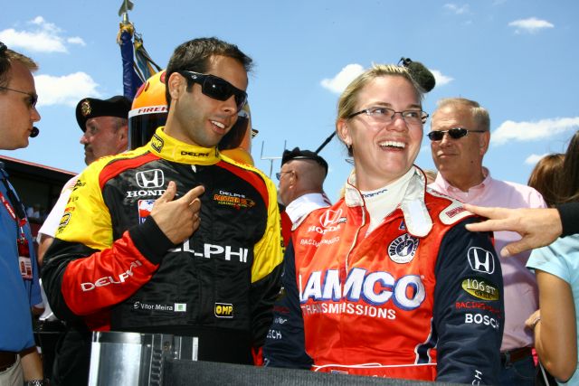 Vitor Meira and Sarah Fisher joke around during driver introductions before the start of the Honda 200 at Mid-Ohio. -- Photo by: Jim Haines