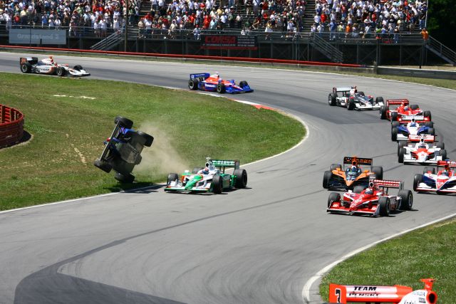 Marco Andretti becomes airborne after making contact with Tony Kanaan during the Honda 200 at Mid-Ohio. -- Photo by: Jim Haines
