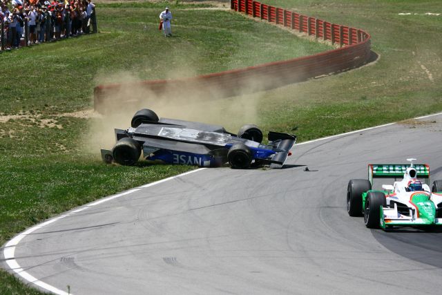 Marco Andretti lands upside down after making contact with Tony Kanaan during the Honda 200 at Mid-Ohio. -- Photo by: Jim Haines