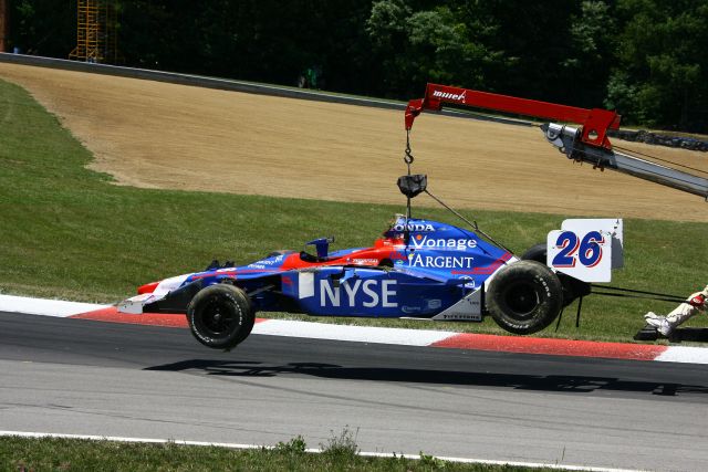 Marco Andretti's Damaged IndyCar being hauled off the course during the Honda 200 at Mid-Ohio. -- Photo by: Jim Haines