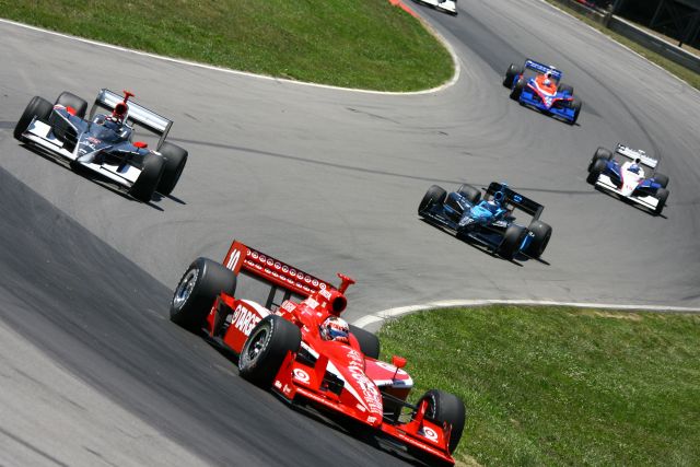 Dan Wheldon leads Tomas Scheckter and Danica Patrick during the Honda 200 at Mid-Ohio. -- Photo by: Jim Haines