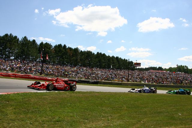 Dan Wheldon leads Buddy Rice and Ryan Hunter-Reay during the Honda 200 at Mid-Ohio. -- Photo by: Jim Haines