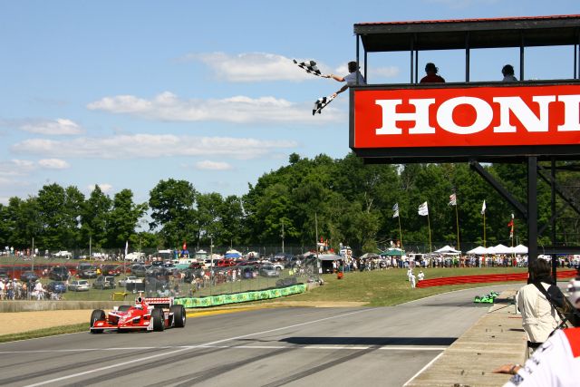 Scott Dixon takes the checkered flag during the Honda 200 at Mid-Ohio. -- Photo by: Jim Haines