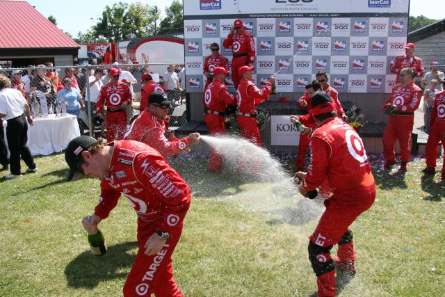 Scott Dixon and his crew celebrate their win with a refreshing drink after winng the Honda 200 at Mid-Ohio. -- Photo by: Shawn Payne