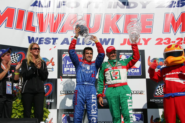 Andretti Green driver Dario Franchitti, left, celebrates victory with Kim Green. right. -- Photo by: Ron McQueeney