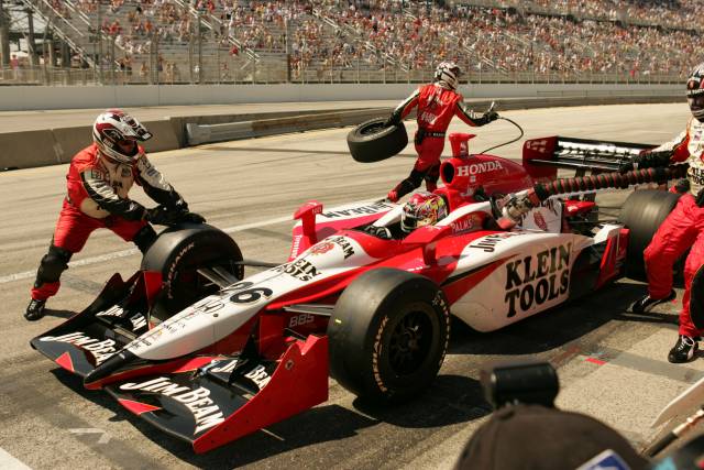 Wheldon prepares to burn out of the pits. -- Photo by: Michael Voorhees