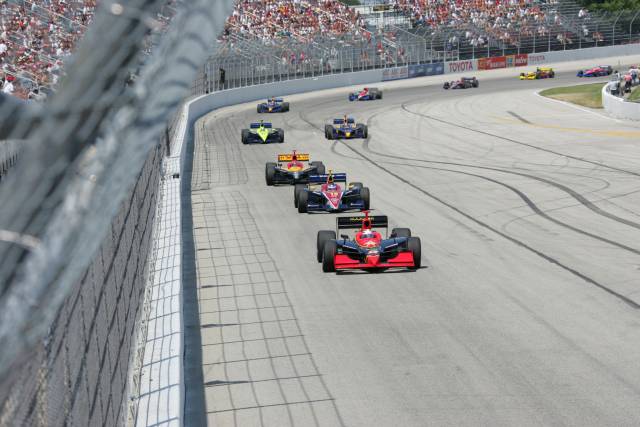 Buddy Lazier leads the field down the front stretch. -- Photo by: Ron McQueeney