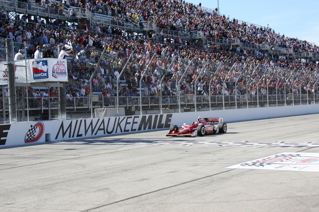 Scott Dixon takes the checkered flag to win the ABC Supply/A.J. Foyt 225 at The Milwaukee Mile. -- Photo by: Ron McQueeney