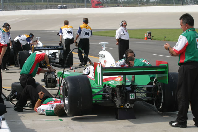 #11 Andretti Green Racing team at work on Tony Kanaan's car during practice -- Photo by: Chris Jones