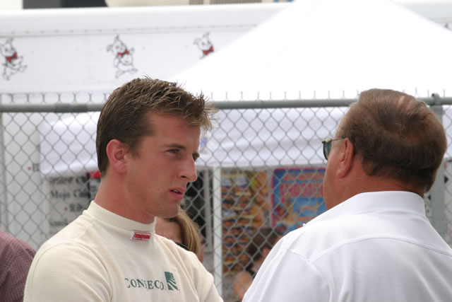 A.J. Foyt IV, left talks to team owner and grandfather, A.J. -- Photo by: Chris Jones