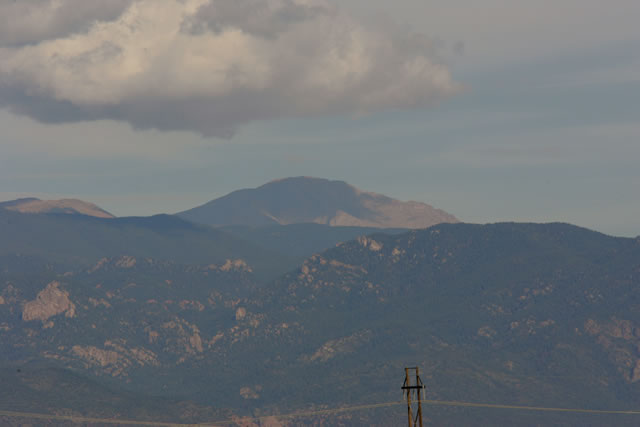 The Pikes Peak mountain range behind track -- Photo by: Ron McQueeney