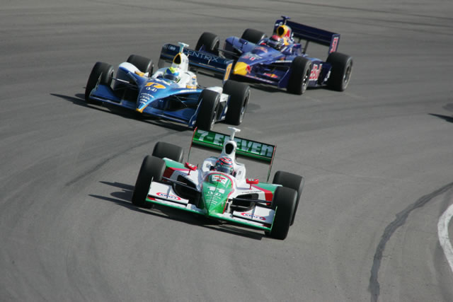 Early race action from #11 Andretti Green driver, Tony Kanaan, front, and #17 Rahal Letterman Racing Team Centrix driver Vitor Meira with #51 Red Bull Cheever Racing driver Alex Barron in close pursuit -- Photo by: Ron McQueeney