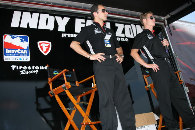 Team Penske drivers #3 Helio Castroneves and #6 Ryan Briscoe speaking with fans at the Indy Fan Zone trailer on race day at Richmond. -- Photo by: Chris Jones