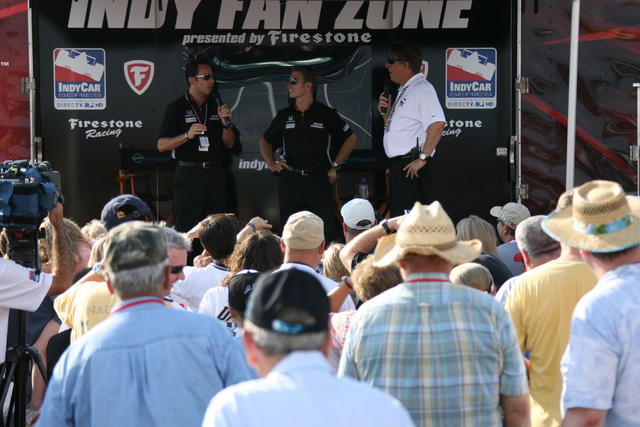 Team Penske teammates #3 Helio Castroneves and #6 Ryan Briscoe speak with fans at the Indy Fan Zone trailer on race day at Richmond. -- Photo by: Chris Jones