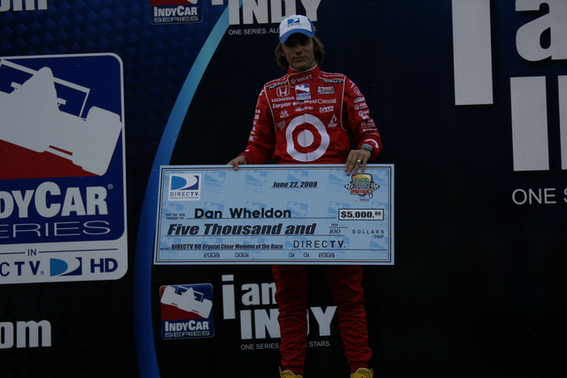 #10 Dan Wheldon is presented with a $5,000 check from Direct TV for the 