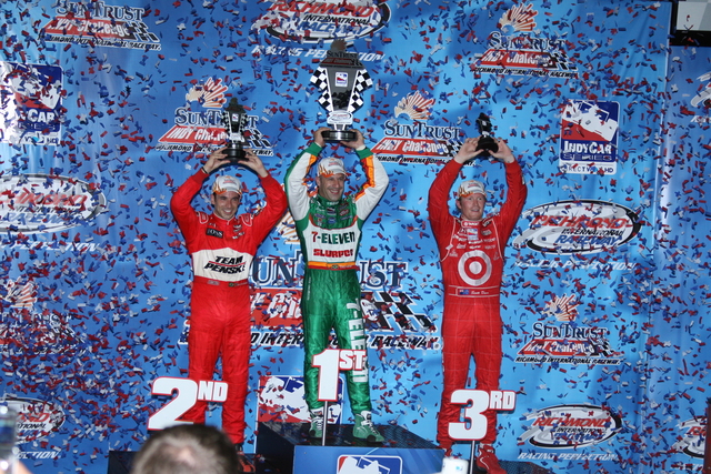 Podium finishers 1st #11 Tony Kanaan, 2nd #3 Helio Castroneves and 3rd #9 Scott Dixon display their trophies after placing in the SunTrust Indy Challenge at Richmond International Raceway. -- Photo by: Chris Jones