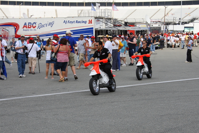 Team Penske drivers #3 Helio Castroneves and #6 Ryan Briscoe ride around on their mini bikes before the start of the SunTrust Indy Challenge at Richmond. -- Photo by: Shawn Payne
