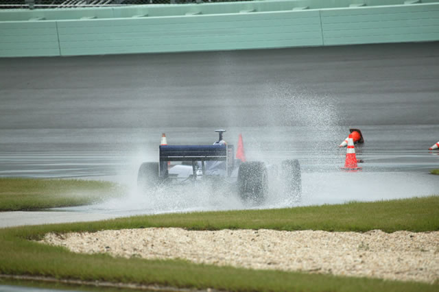 Alex Barron in the No. 51 Red Bull Cheever Racing Dallara Chevrolet drives in the rain at Homestead-Miami Speedway -- Photo by: Ron McQueeney