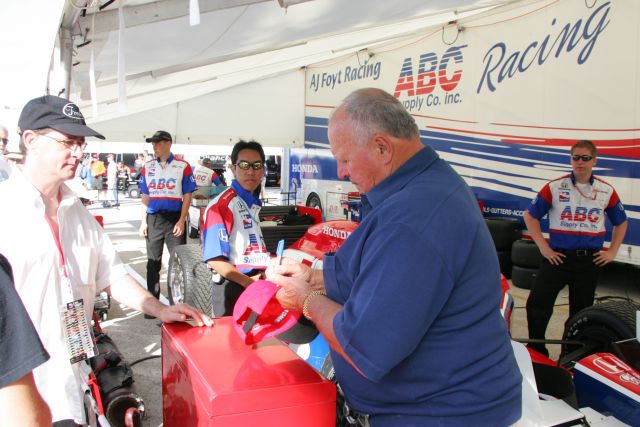 AJ Foyt signs autographs for fans in the Paddock area at St. Petersburg. -- Photo by: Chris Jones