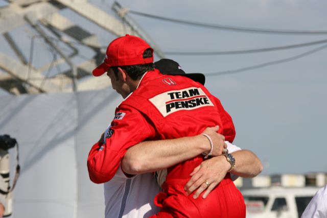Helio Castroneves getting a victory hug. -- Photo by: Dana Garrett