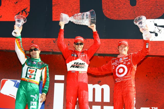 Tony Kanaan(left), Helio Castroneves, and Scott Dixon show off their trophies. -- Photo by: Jim Haines