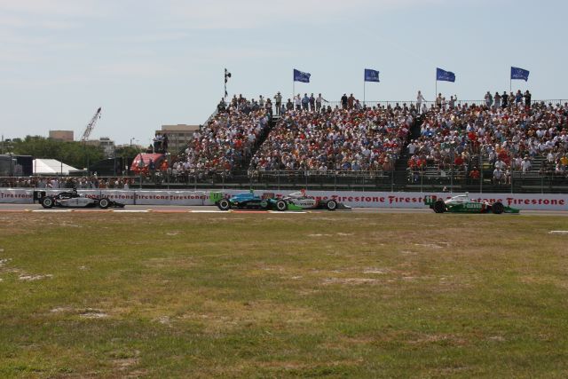 The crowd watches as driver number 11, Tony Kanaan takes the lead. -- Photo by: Shawn Payne