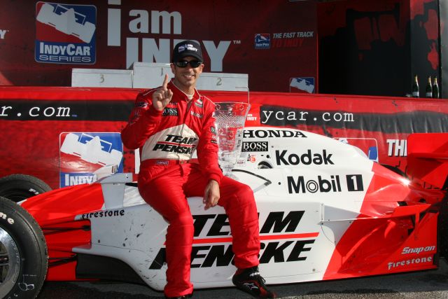Helio Castroneves proclaiming his victory. -- Photo by: Shawn Payne