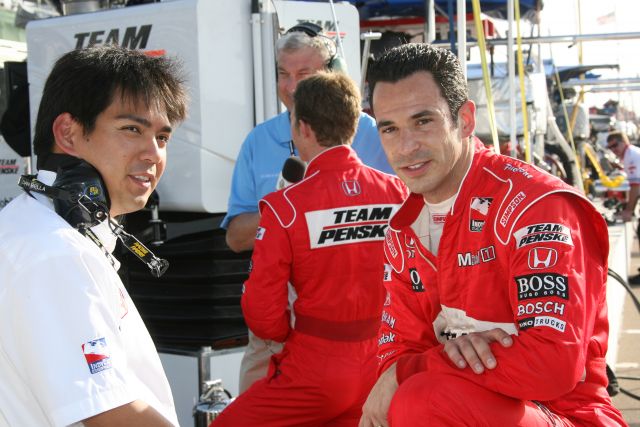 Helio Castroneves talks with his crew before practice at St. Petersburg. -- Photo by: Chris Jones