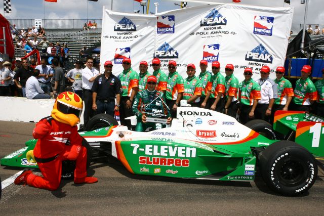 Tony Kanaan and his crew pose for pictures after winning Peak Motor Oil Pole Award at St. Petersburg. -- Photo by: Jim Haines