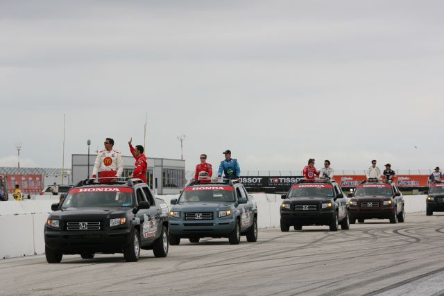 Caravan of IndyCar Series drivers making their way around the St. Petersburg road course during driver introductions. -- Photo by: Chris Jones