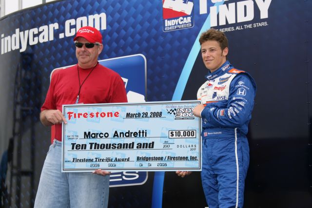 AGR driver Marco Andretti receives the Firestone Tire-ific Award for $10,000. -- Photo by: Chris Jones