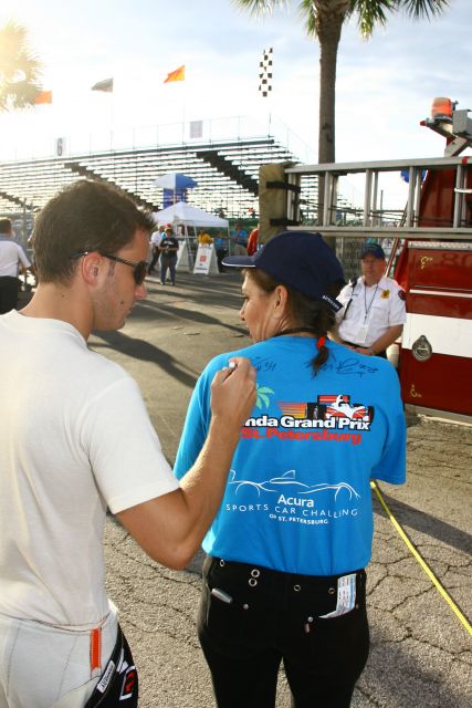 #34 driver Franck Perera signs a fans shirt prior to start of race. -- Photo by: Jim Haines