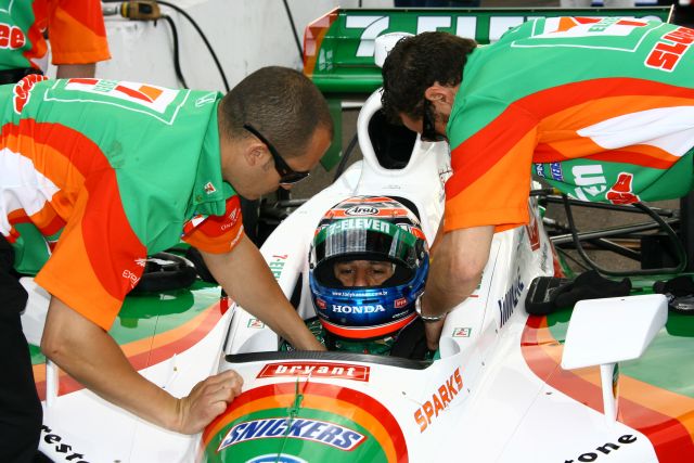 #11 AGR driver Tony Kanaan gets some assistance getting strapped in for start of race. -- Photo by: Jim Haines