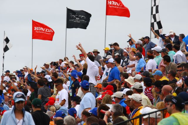 Enthusiastic St. Pete race fans cheer-on drivers during race action. -- Photo by: Ron McQueeney