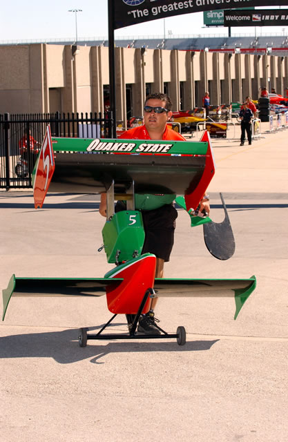 # 5 Quaker State Telmex Tecate team member carts wings to pitlane -- Photo by: Dana Garrett