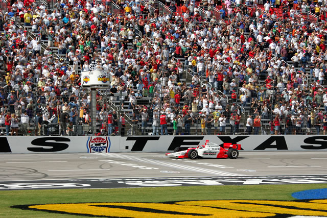 # 3 Marlboro Team Penske driver Helio Castroneves takes the checker flag at the Chevy 500 -- Photo by: Ron McQueeney