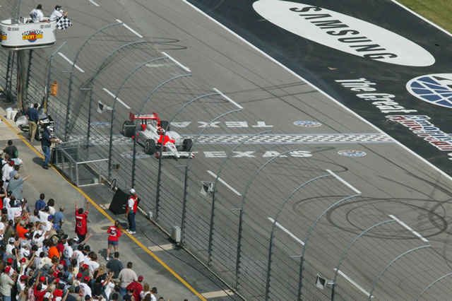 # 3 Marlboro Team Penske driver Helio Castroneves takes the checker flag at the Chevy 500 -- Photo by: Shawn Payne