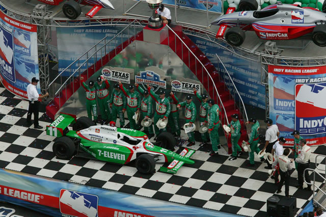 # 11 Team 7-11 driver Tony Kanaan along with team members celebrate winning the 2004 IRL Championship -- Photo by: Shawn Payne