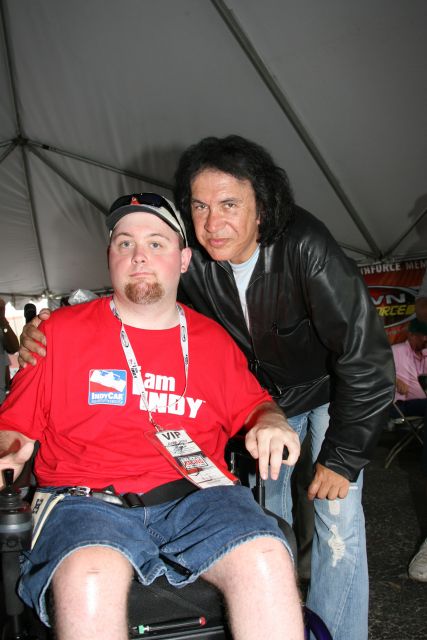 Gene Simmons poses for pictures with a fan at Texas Motor Speedway before the Bombardier Learjet 550k. -- Photo by: Chris Jones