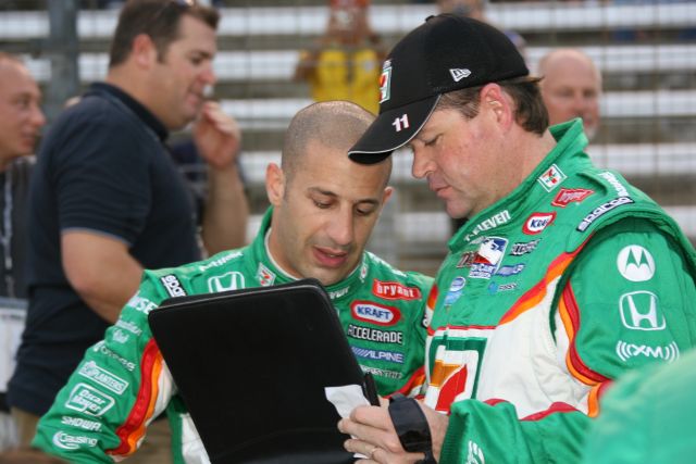 Tony Kanaan and crew talk at Texas Motor Speedway before the Bombardier Learjet 550k. -- Photo by: Chris Jones