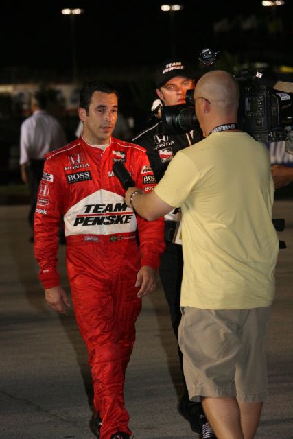 Helio Castroneves gets interviewed after a massive incident takes him and several other drivers out of the race during the Bombardier Learjet 550k at Texas Motor Speedway. -- Photo by: Chris Jones