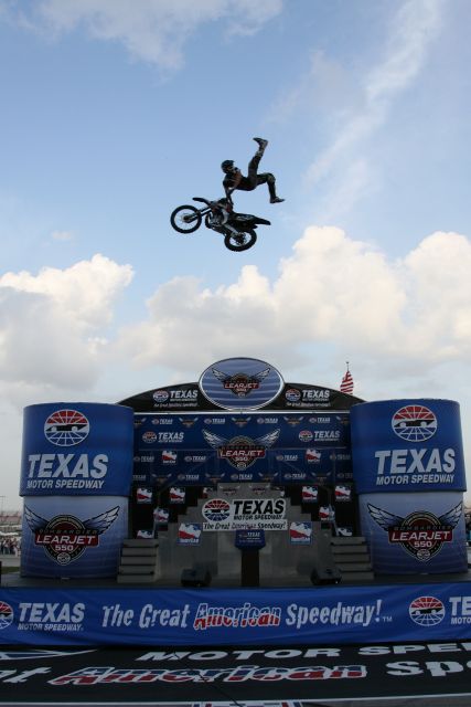 A member of the MD Extreme Stunt Show performs during pre-race ceremonies at the Bombardier Learjet 550k. -- Photo by: Shawn Payne