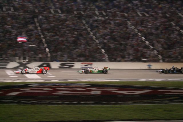 Sam Hornish Jr. leads Tony Kanaan and Danica Patrick to the checkered flags for the Bombardier Learjet 550k. -- Photo by: Shawn Payne