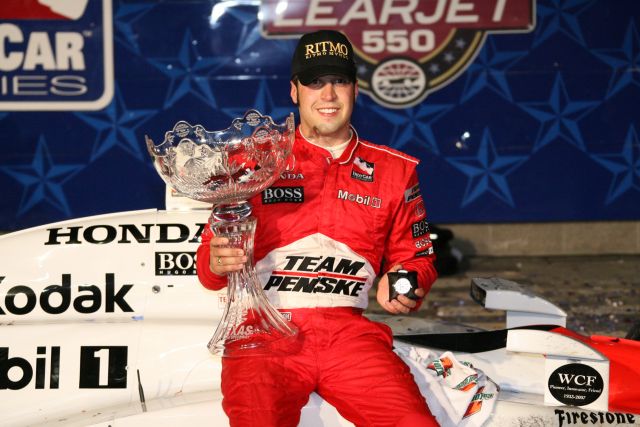Sam Hornish Jr. shows off the hardware he collected for winning the Bombardier Learjet 550k. -- Photo by: Shawn Payne