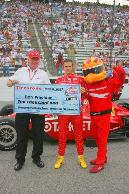 Dan Wheldon get the Firestone Performance Award from his performance during the race at Milwaukee. -- Photo by: Steve Snoddy