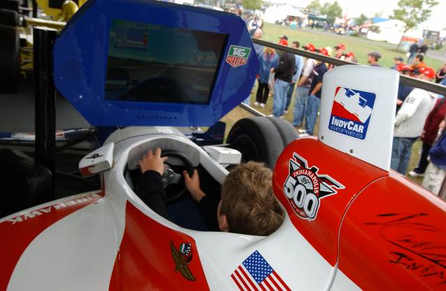 A fan tries his hand on the IndyCar Series Pole Position. -- Photo by: Dana Garrett