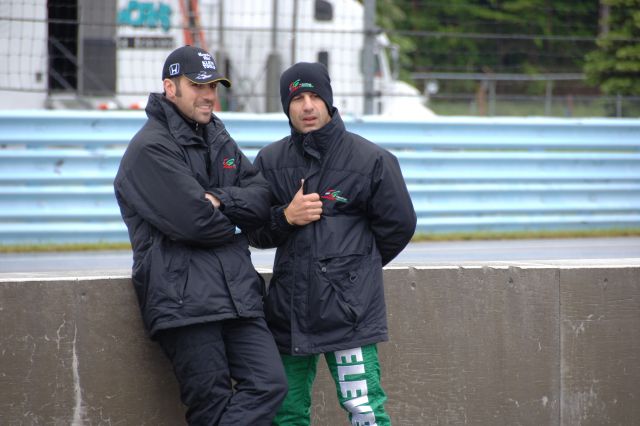 Dario Franchitti, left, and Tony Kanaan stay warm. -- Photo by: Dana Garrett