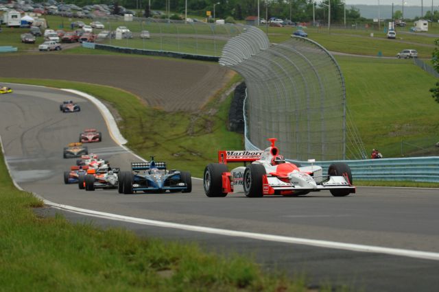 Helio Castroneves leads the pack -- Photo by: Jim Haines